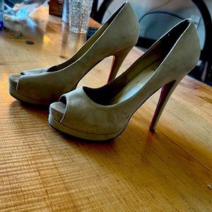 Christian Louboutin off white suede peep toe heels.